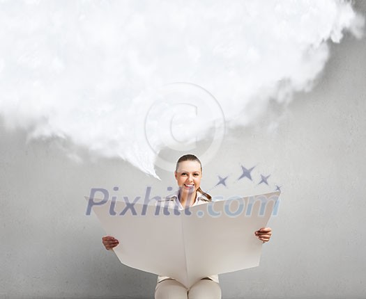 Portrait of young businesswoman in white suit reading blank newspaper Portrait of young businesswoman in white suit reading blank newspaper