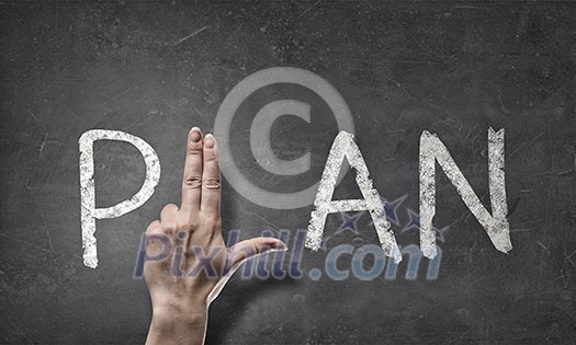 Close up of hands making letter in word plan Close up of hands making letter in word plan