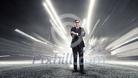 Middle aged confident businessman with arms crossed on chest Middle aged confident businessman with arms crossed on chest