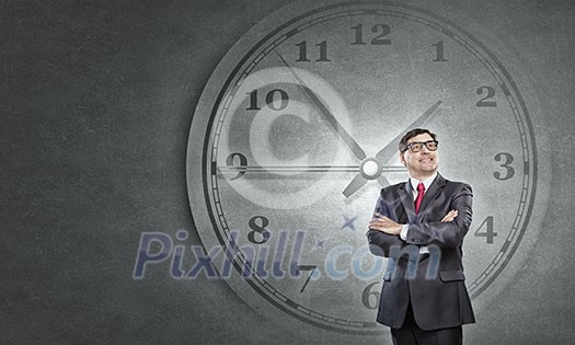 Middle-aged confident businessman in glasses and time concept Middle-aged confident businessman in glasses and time concept