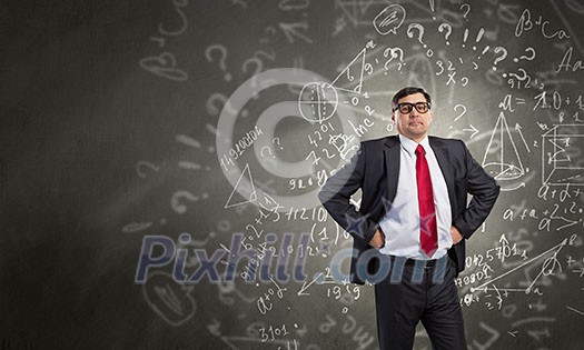 Middle aged confident businessman hands on waist Middle aged confident businessman hands on waist