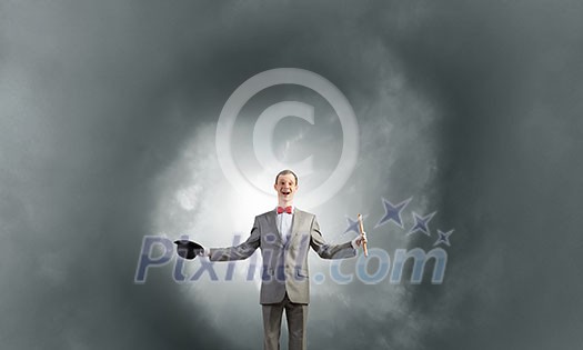 Young businessman in suit with hat and flute Young businessman in suit with hat and flute