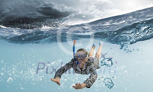 Young businesswoman in suit and diving mask swimming under water Young businesswoman in suit and diving mask swimming under water