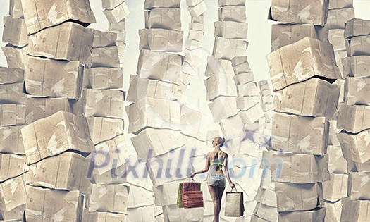 Beautiful young girl in bikini with shopping bags and pile of carton boxes Beautiful young girl in bikini with shopping bags and pile of carton boxes