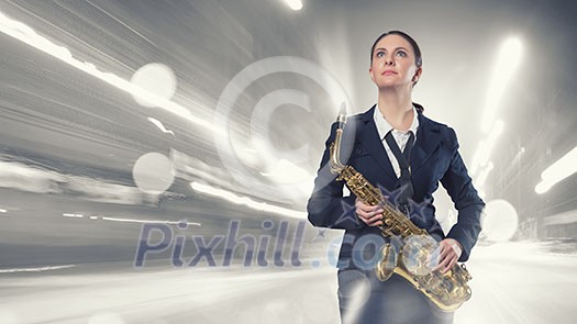 Young woman in suit with saxophone in hands Young woman in suit with saxophone in hands