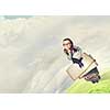 Wideangle picture of funny schoolgirl with paper plane in hand