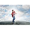 Handsome teenager cool acive boy riding skateboard