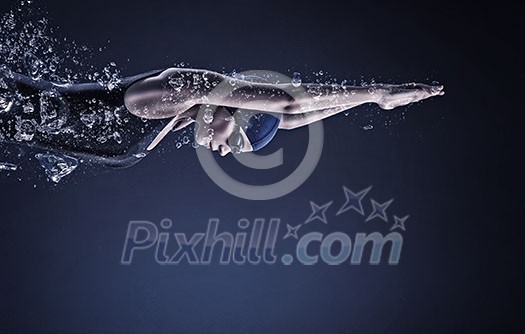 Young woman swimmer in cap and glasses under water Young woman swimmer in cap and glasses under water