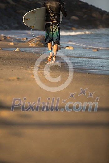 Young boy surfing the wave in a sunny day Young boy surfing the wave in a sunny day
