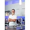 Senior man standing in his renovated, modern kitchen,