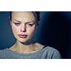 Young woman suffering from severe depression/anxiety/sadness, crying, tears coming from her eyes