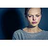 Young woman suffering from severe depression/anxiety/sadness, crying, tears coming from her eyes