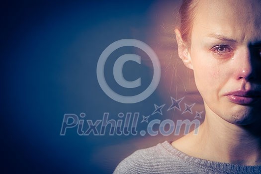 Young woman suffering from severe depression/anxiety/sadness, crying, tears coming from her eyes Young woman suffering from severe depression/anxiety/sadness, crying, tears coming from her eyes