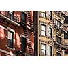 Old apartment building with fire escapes, Manhattan, New York City