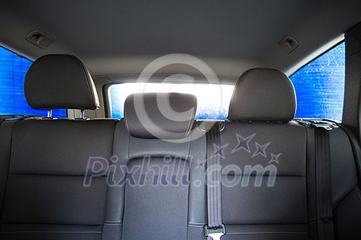 Car in a carwash - view from the interior of the vehicle Car in a carwash - view from the interior of the vehicle