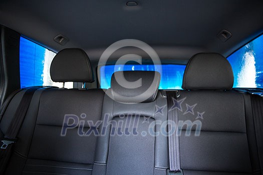 Car in a carwash - view from the interior of the vehicle Car in a carwash - view from the interior of the vehicle