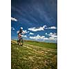 Pretty, young female biker outdoors on her mountain bike (motion blurred image)