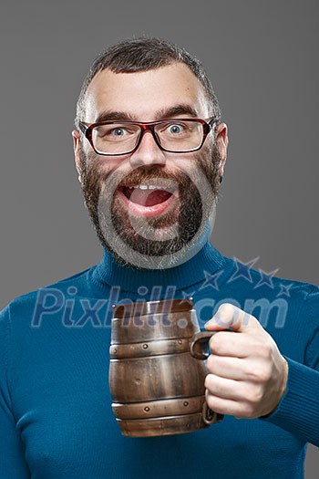 Happy man drinking beer from the mug. Happy man drinking beer from the mug.