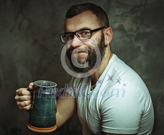 Happy man drinking beer from the mug. Happy man drinking beer from the mug.