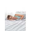 Beautiful young woman sleeping in bed (color toned image; shallow DOF)