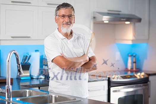 Senior man standing in his renovated, modern kitchen, Senior man standing in his renovated, modern kitchen,