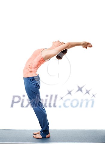 Beautiful sporty fit woman practices Sivananmda yoga asana Anuvittasana - standing back bend pose isolated on white Beautiful sporty fit woman practices Sivananmda yoga asana Anuvittasana - standing back bend pose isolated on white