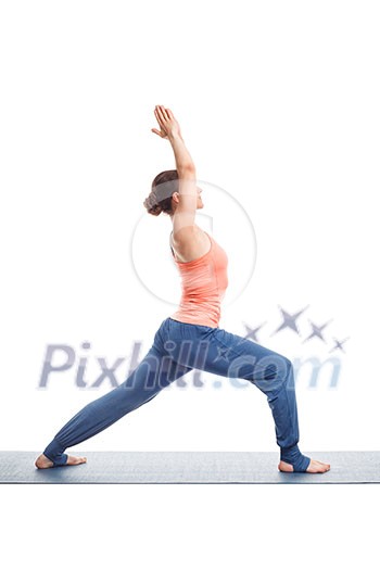 Beautiful sporty fit yogini woman practices yoga asana Virabhadrasana 1 - warrior pose 1 isolated on white Beautiful sporty fit yogini woman practices yoga asana Virabhadrasana 1 - warrior pose 1 isolated on white