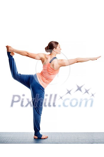 Beautiful sporty fit woman doing yoga asana Natarajasana - Lord of the dance pose isolated on white Beautiful sporty fit woman doing yoga asana Natarajasana - Lord of the dance pose isolated on white