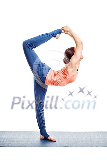 Beautiful sporty fit woman doing yoga asana Natarajasana - Lord of the dance pose advanced variation isolated on white Beautiful sporty fit woman doing yoga asana Natarajasana - Lord of the dance pose advanced variation isolated on white
