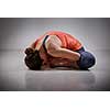 Beautiful sporty fit woman practices yoga asana Baddha konasana - bound angle pose