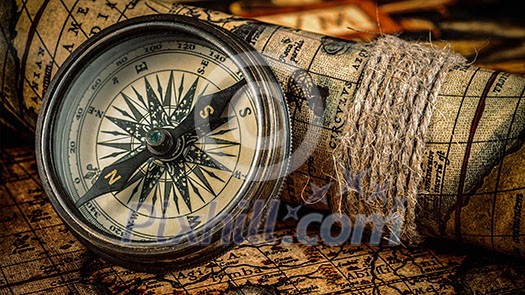 Travel geography navigation concept background - panorama of old vintage retro compass on ancient world map Travel geography navigation concept background - panorama of old vintage retro compass on ancient world map