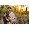 Senior man on his mountain bike outdoors (shallow DOF; color toned image)