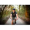 Senior man on his mountain bike outdoors (shallow DOF; color toned image)