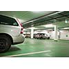 Cars parhed in an underground parking/garage (color toned image; shallow DOF)