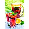 Refreshing fruit punch beverage in pitcher and glasses