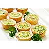 Plate of many mini bite size quiche appetizers