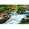 Water rushing among rocks in river rapids in Ontario Canada