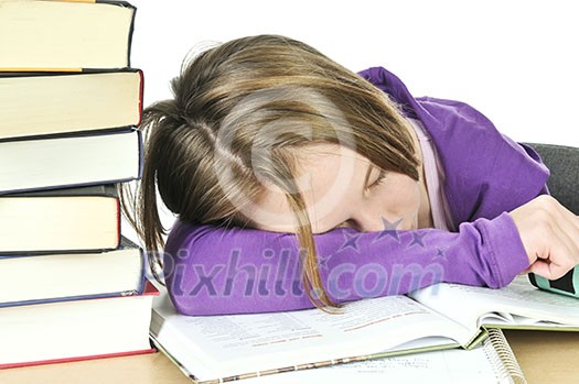 Teenage girl studying at the desk being tired Teenage girl studying at the desk being tired