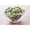 Pumpkin seeds close up in glass bowl