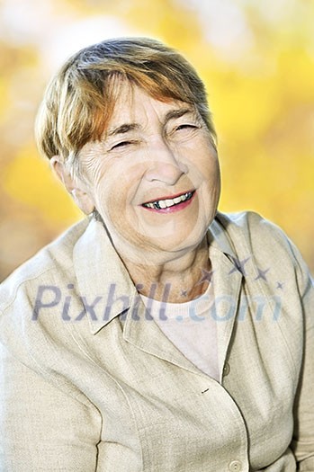 Senior woman laughing and smiling with abstract background Senior woman laughing and smiling with abstract background