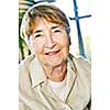Senior woman on sunny day smiling in contentment