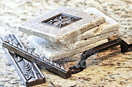 Ceramic tiles and borders for backsplash close up on a granite surface Ceramic tiles and borders for backsplash close up on a granite surface