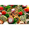 Closeup on platter of assorted meat tortilla wraps