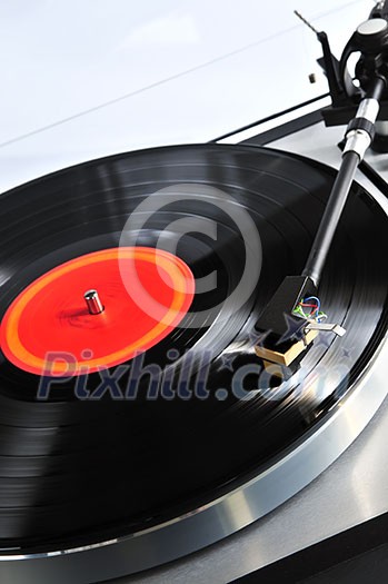 Vinyl record spinning on turntable close up Vinyl record spinning on turntable close up