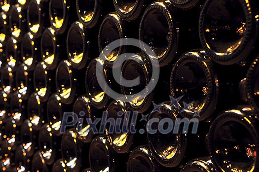 Large stack of wine bottle bottoms in winery Large stack of wine bottle bottoms in winery