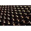 Large stack of wine bottle bottoms in winery