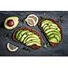 Avocado sandwich on dark rye bread made with fresh sliced avocados from above