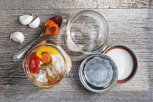 Home preserving mixed vegetables by pickling in glass canning jars Home preserving mixed vegetables by pickling in glass canning jars