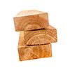 Edge of three cedar two by four wood boards on white background