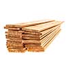 Stacks of cedar one by six inch wood planks on white background